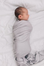 Mebie Baby Stone Stretch Swaddle. Mebie Baby Bamboo Stretch Swaddle. Gender Neutral for take home outfits and swaddling newborns.