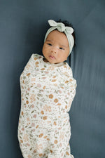 Mebie Baby Gender Neutral Infant Muslin Swaddle its 100% cotton.